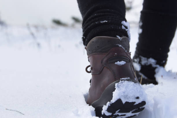 istock Woman´s Legs Walking on the Snow 931945194