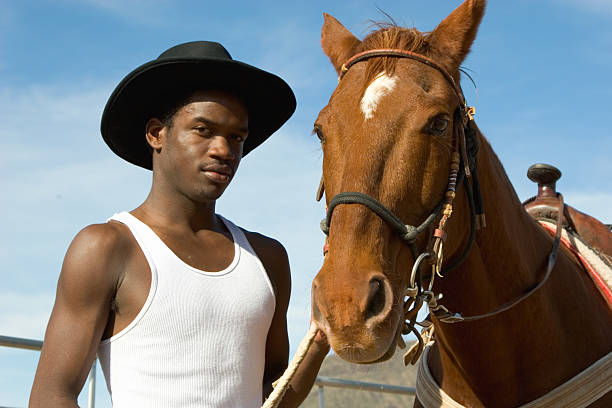 Cowboys riding a horse over the mountains