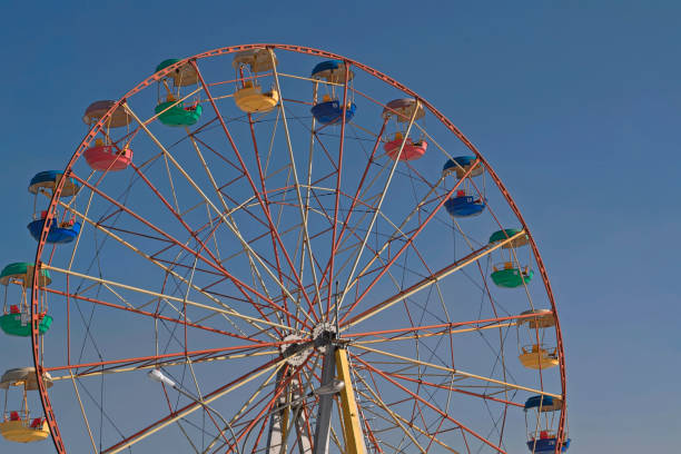 istock Ferris wheel against the blue sky 931957512