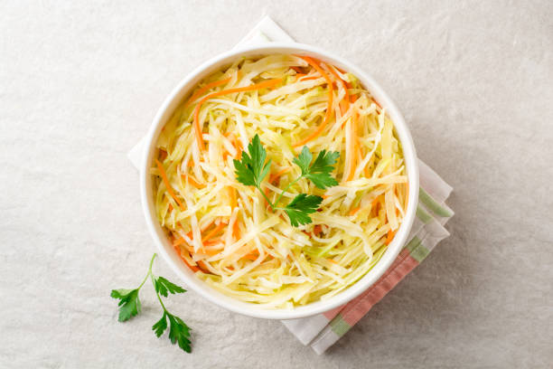 istock Fresh coleslaw salad in bowl on gray stone background. 931961610