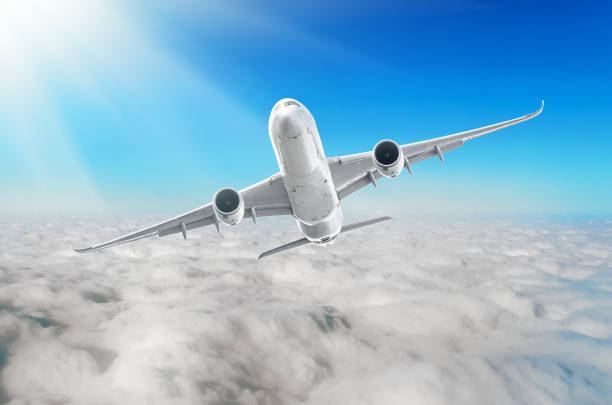 istock White aircraft is climb flight heights, at the bottom there is a overcast clouds. 931969142