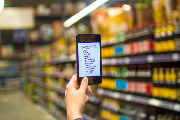 istock Person reading shopping list on smartphone 931972262