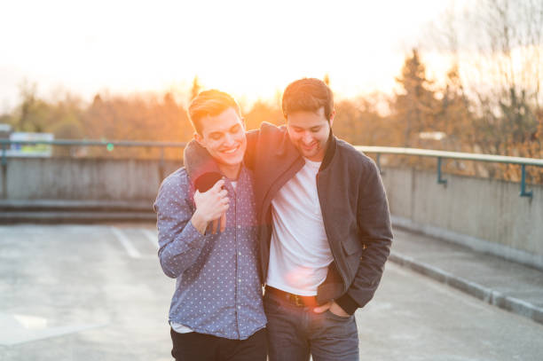istock Affectionate male couple walking together in the evening 931972706