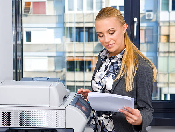 istock woman secretary at copy machine 93198208