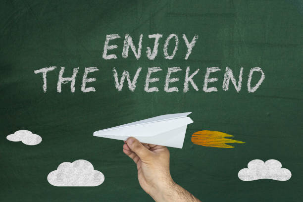 flying paper plane with text Enjoy the Weekend