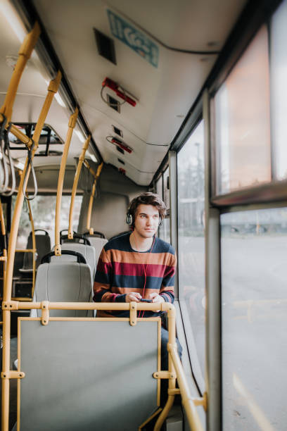istock The young man sits on the bus and looks out the window 931993036
