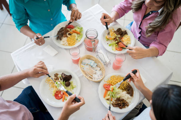 istock Group of people eating at a self-service restaurant 931993990