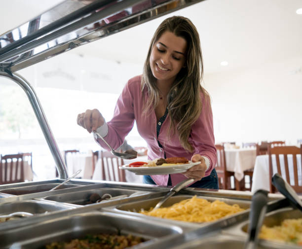 istock Woman serving food at a buffet restaurant 931994160