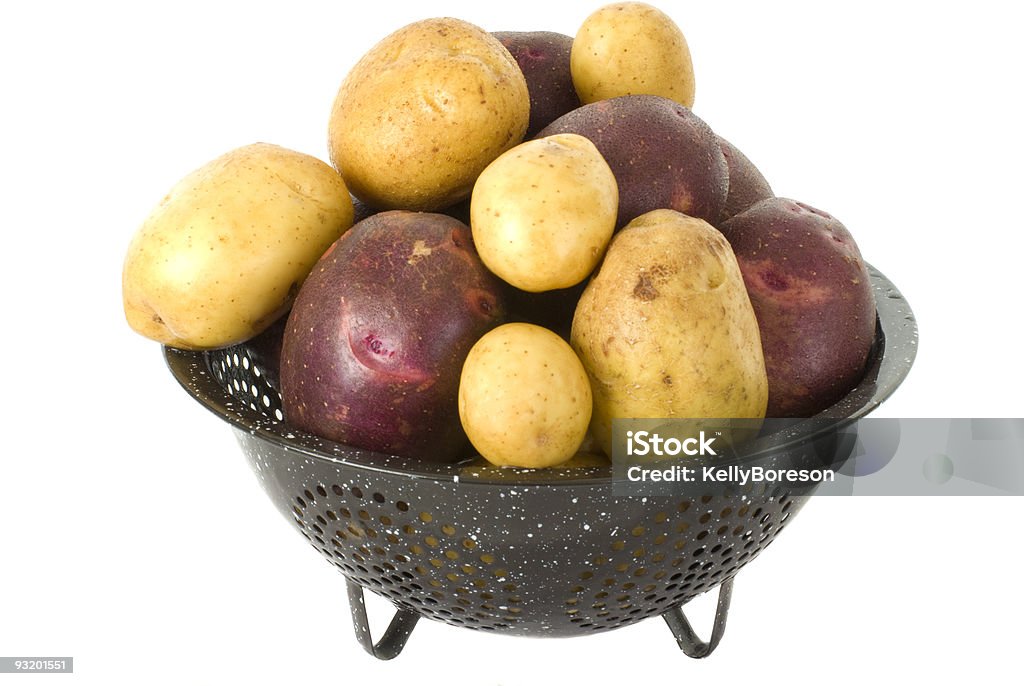 Papas en Colender frescos - Foto de stock de Agricultura libre de derechos