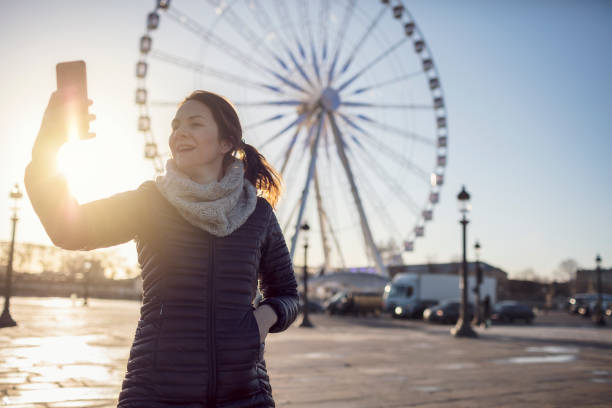 istock Beautiful woman taking selfies at Paris streets 932016732