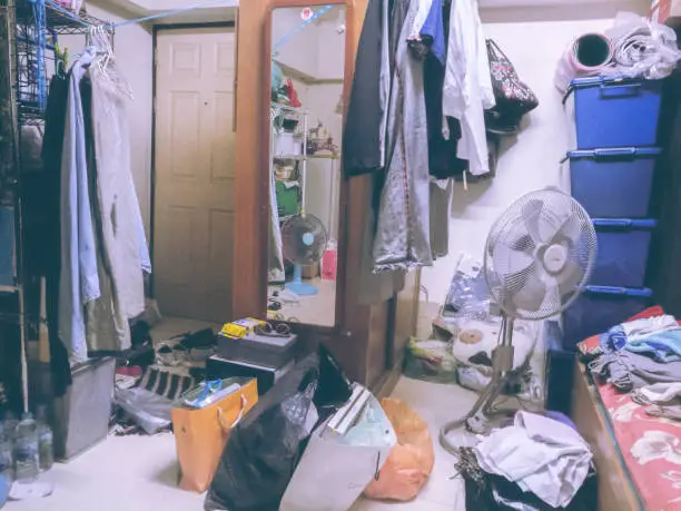 Room is untidy with all clothes that were laundry but cannot manage to the closet