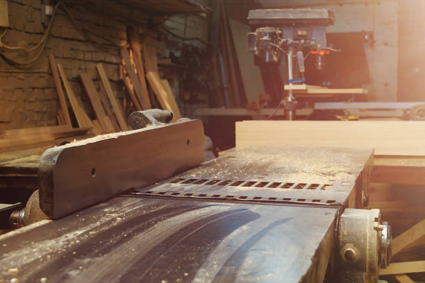 istock Woodworking Plane Machine in Carpentry Workshop. Machine Tool in Factory. 932021906
