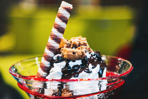 istock Cup of ice cream on glass with cones 932022898