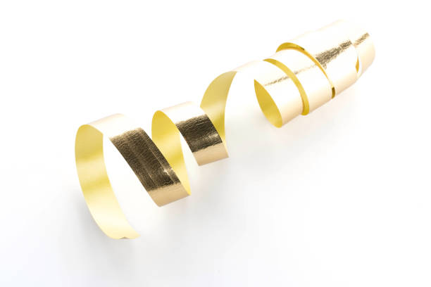 istock Golden ribbon roll isolated on white background 932032324