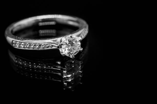 istock Close up Jewelry diamond ring on black background with reflection 932038226