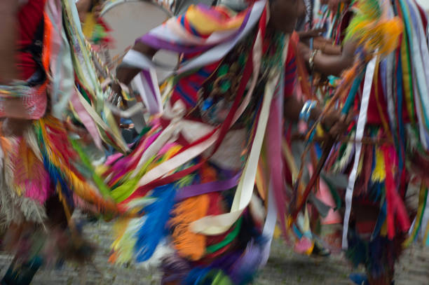 istock Photo in motion: People dancing and playing in brazilian carnival festivities. 932040560