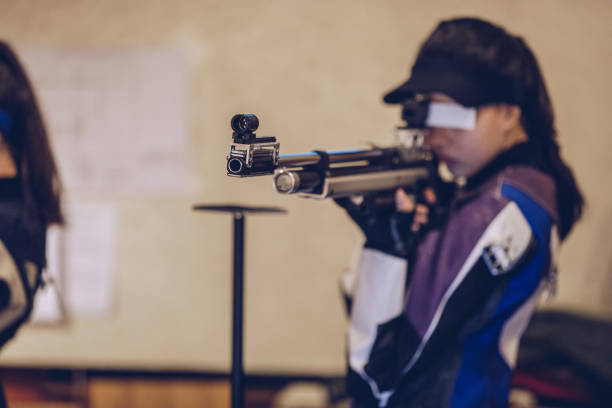 istock Beautiful woman at shooting range 932040922