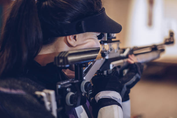 istock Woman aiming a air rifle 932043924