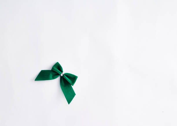 istock single green velvet bow isolated on white 932048266