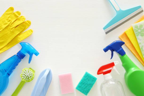 istock Spring cleaning concept with supplies on wooden table. 932055214