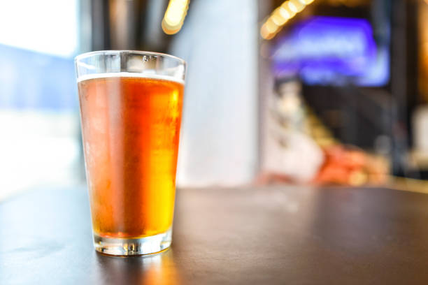 istock Craft Beer Glass and Bokeh Background 932059300
