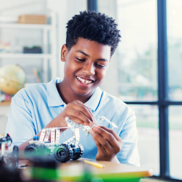 istock African American high school student building robot 932070388