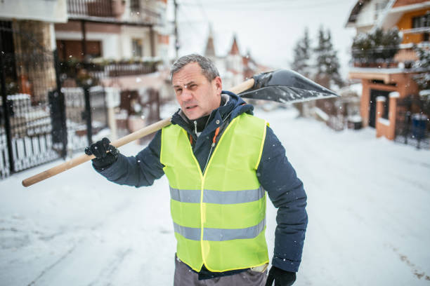 istock Man After Shoveling Parking Lot 932070632