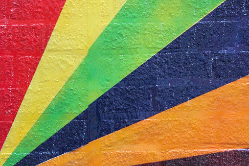 A close up macro shot of diagonal colored lines radiating on an old brick wall in Columbus, OH