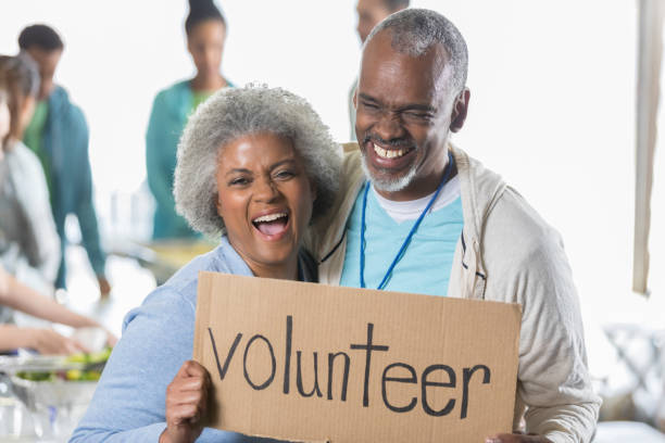 istock Active senior couple volunteer during food drive 932074496