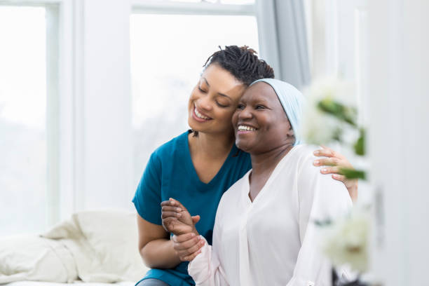 istock Young woman embraces ill mother 932074784