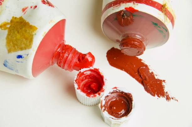 istock Two open tubes of artist's oil paint, both with caps off 932074810
