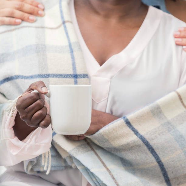 istock Woman is wrapped in a warm blanket 932074812