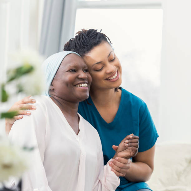 istock Loving adult daughter comforts ill mother 932074814