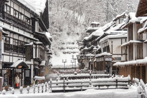 heavy snow blizzard in obanazawa ginzan onsen, japan hot springs town. - prefeitura de yamagata imagens e fotografias de stock