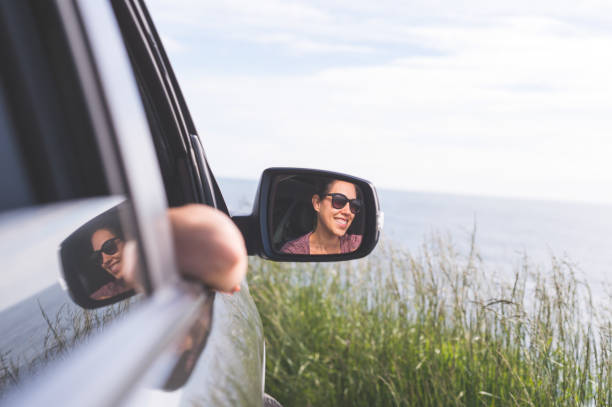 istock Tourist admiring Oregon Coast from her car 932077822