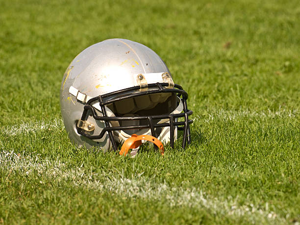 istock Football Helmet on the grass 93207896