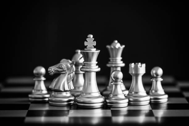 istock Strategy chess battle Intelligence challenge game on chessboard. Success the strategy concept. Chess business leader and success idea. Chess strategy game business competition success play. 932079162