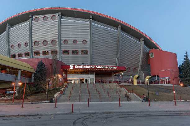 CALGARY, Canada - March 12. 2018: Scotiabank Saddledome with Calgary Flames fans before NHL match against Edmonton Oilers CALGARY, Canada - March 12. 2018: Scotiabank Saddledome with Calgary Flames fans before NHL match against Edmonton Oilers scotiabank saddledome stock pictures, royalty-free photos & images
