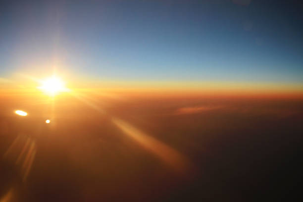 istock the sunset above clouds at the plane 932086130