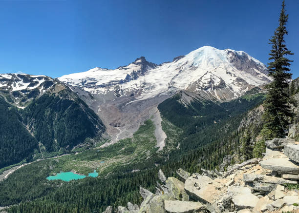 istock Mount Rainier and a turquoise alpine lake 932092508