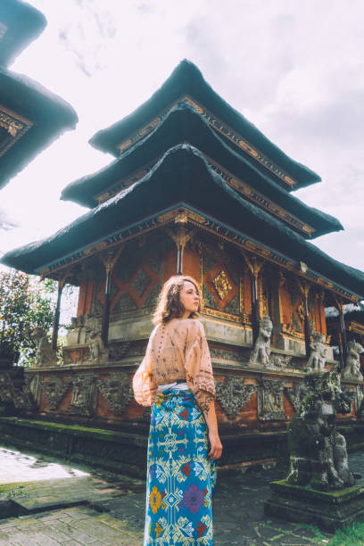 istock Woman walking in Balinese temple 932092950