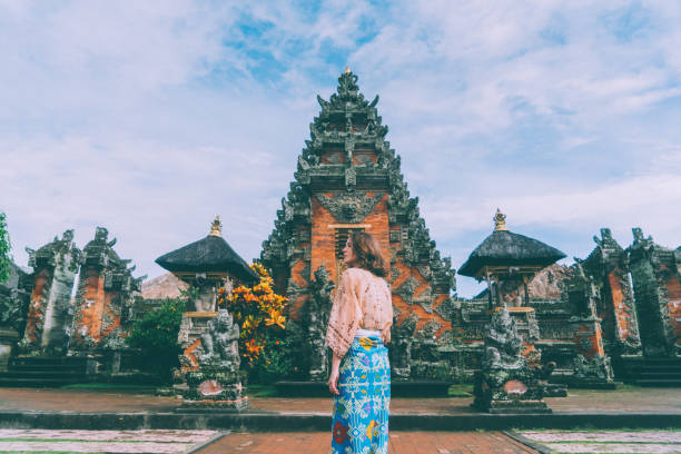 istock Woman walking in Balinese temple 932092952