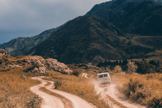 istock The car is moving forward along a dirt road. 932093656