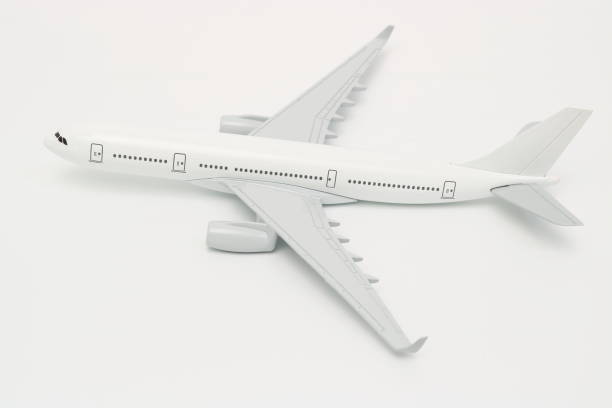 istock Side view of miniature passenger airplane on white isolated background. 932097648
