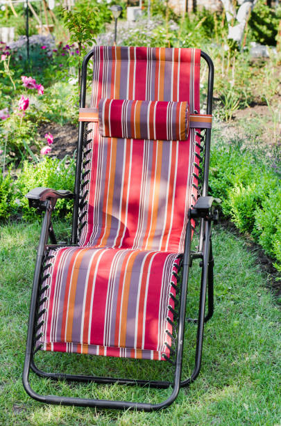istock Chaise-longue in the summer sunny garden. 932103736