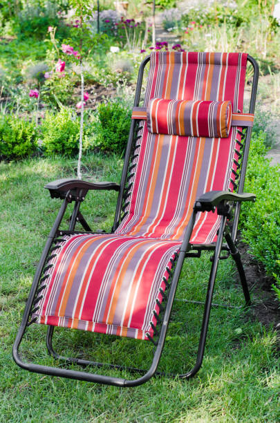 istock Chaise-longue in the summer sunny garden. 932103738