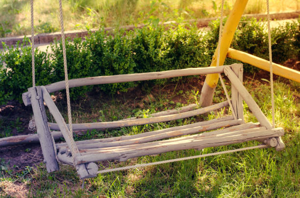 istock Wooden swing hand-made in the garden. 932103772