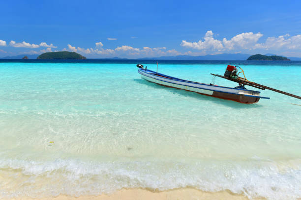istock long tail boat in tropical paradise beach Nyaung Oo Phee island 932106974