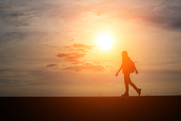 istock Hiker with backpack relaxing and enjoying sunset. 932109134