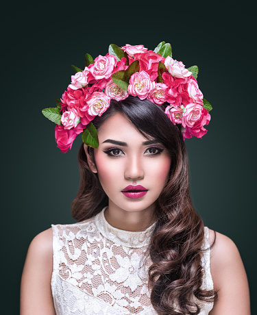 Portrait of young beautiful asian woman with flower wreath